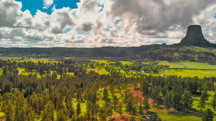 Obraz premium Aerial view of Devils Tower surrounding countryside in summer season, Wyoming