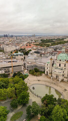 Vertical aerial view of Vienna, Austria. Central streets and buildings from drone on a cloudy day