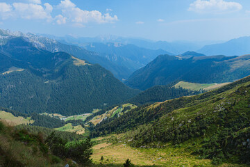 Fototapeta na wymiar The mountains of the Brembana valley during a summer day, seen from the San Marco pass, Italy - July 2022.