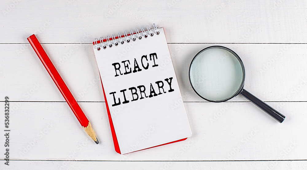 Poster react library text on notebook on white wooden background , business concept