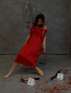 Incident Simulates Scenario Murdered And Bitter Sexual Asian Woman One Person Killed With A Knife And Hammer Dead Lies On Floor In A Red Dress In A Black Room Filled With Blood By The Murderer's 