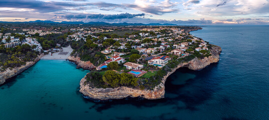 Sunset over Cala Anguila-Cala Mendia from a drone, Porto Cristo, Majorca, Spain, Europe