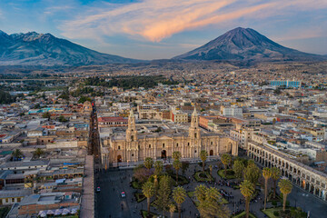 Drone shot of the Plaza de Armas with the Arequipa Cathedral and the Misti Volcano in the...