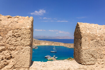 Panoramic view of colorful harbor in Lindos village, Rhodes. Aerial view of beautiful landscape,...