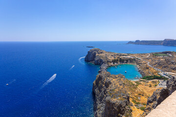 Panoramic view of Saint Pauls Bay in shape of heart from Acropolis of ancient city of Lindos,...