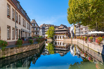 Fototapeta na wymiar Picturesque half timbered buildings and the Maison des Tanneurs (tanners house) in the Petite France canal zone along the Ill river in the historic city of Strasbourg, in the Alsace region of France. 