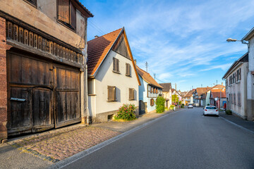 Fototapeta na wymiar One of the main residential streets through Zellwiller, France, one of the lesser known communes in the Bas-Rhin Alsace department of Eastern France.