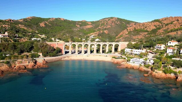 Aerial flight over Viaduc d'Anth&eacute;or and the Massif de L'Esterel on the coast of Mediterranean Sea between Cannes and Saint Raphael. Provence-Alpes-C&ocirc;te d'Azur region in the south of France.