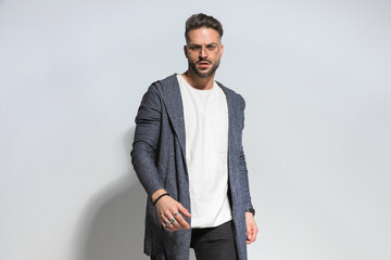 bearded fashion man with style posing in a cool manner