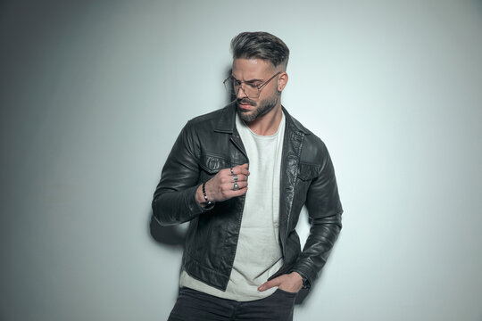 casual guy looking down with a very serious look