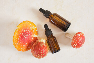 fly agaric red and glass amber dropper bottles
