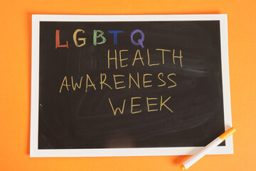 Obraz premium lgbtq health awareness week inscription on board