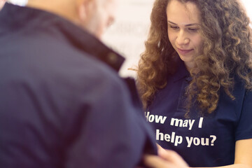 Conference Staff Member scan a QR code from attendee upon arrival to check-in site