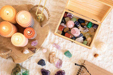 Healing reiki chakra crystals and open organizer. Gemstones for wellbeing, harmony, meditation, relaxation, metaphysical, spiritual practices. Energetical power concept - obrazy, fototapety, plakaty
