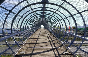 Mesmerizing shot of a bridge with a circular fence around it covering all sides