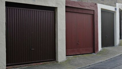 Obraz na płótnie Canvas sidewalk with metal garage doors
