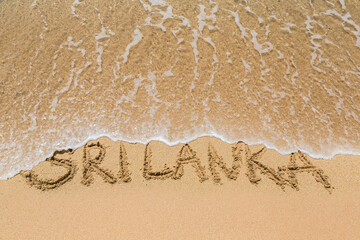 Sri Lanka written in a sandy