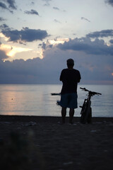 silhouette of a biker man on a sunrise - 536852699
