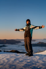 person on top of the mountain for sunrise