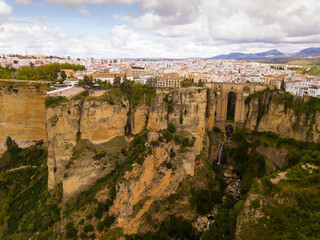 Fototapeta premium Aerial view of Ronda landscape and buildings with Puente Nuevo Bridge, Andalusia, Spain