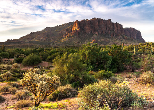 Landscape photograph of the Superstition Mountains at sunrise in Apache Junction, Arizona.