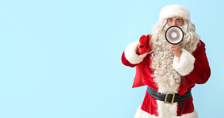 Santa Claus with bag and megaphone on light blue background with space for text