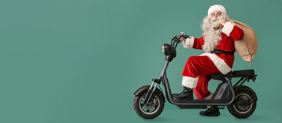 Santa Claus with bag riding bike on green background with space for text