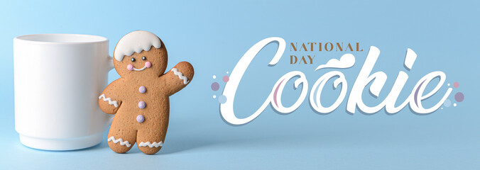 Cup with gingerbread cookie on blue background. National Cookie Day