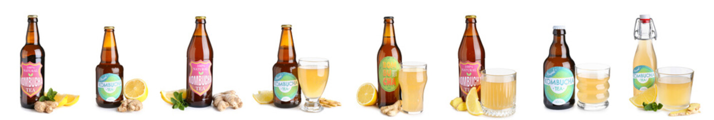 Collection of bottles with tasty kombucha drink on white background
