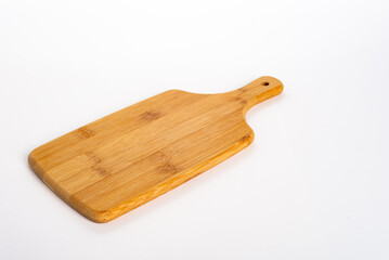 Wooden board for cooking on white background. kitchen utensils concept and healthy eating.