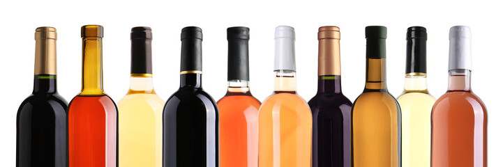 Set of bottles with different kinds of wine on white background