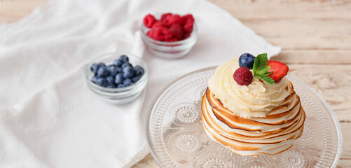 Dessert stand with tasty Pavlova cake on table, closeup