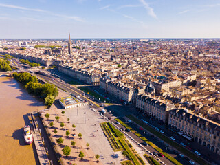 Aerial cityscape of French city Bordeaux and Garonne river - obrazy, fototapety, plakaty