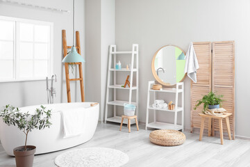 Interior of light bathroom with shelving units, ladder and mirror © Pixel-Shot
