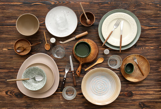 Many different tableware on wooden background, top view
