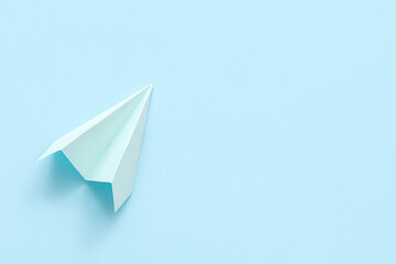 Blue paper plane on color background