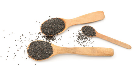 Wooden spoons with black sesame seeds on white background