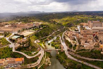 Fototapeta na wymiar View from drone of old houses of Toledo city, capital of province of Toledo in central Spain