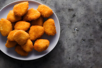 picture of chicken nuggets, made of processed meat, a tasty fast food, savory