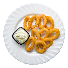 Onion rings in batter on white plate with sauce isolated on white background top view