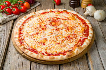 Italian pizza Margherita, cheese, tomato sauce, on wooden table close up - 536861066