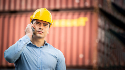 Caucasian worker use smartphone and tablet about business working at the port for transfer products.