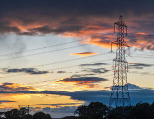 Power line silhouette on colorful sunset background