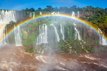 Iguazu Falls dramatic landscape with rainbow, view from Argentina side