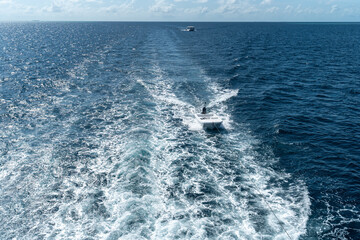 View from the boat stern of the wake (wash) effect on the water from the motor placed on the...