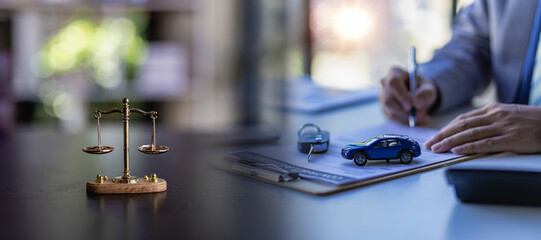 car auction concept and car keys on a wooden table with golden scales concept of selling a car by...
