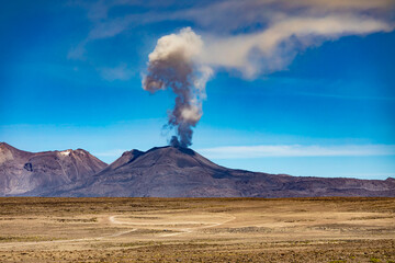 The eruption of the active volcano Sabancaya on September 20, 2022 with an ash plume in the blue...