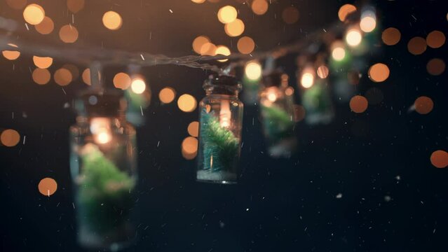 Christmas decoration with small bottle shaped lamps hanging at night