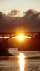 Sunset landscape from the San Roque dam, looking to a large bridge and the last minutes of  sunlight in Villa Carlos Paz , Cordoba 
