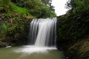 Fototapeta na wymiar A small and beautiful waterfall in the bush.